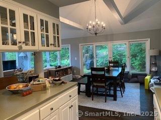 7 White Birch Rd, Wilton, CT 06897 - dining space featuring a chandelier, plenty of natural light, and lofted ceiling