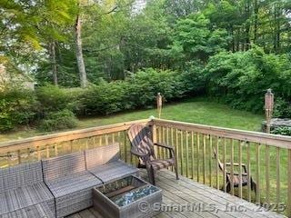 7 White Birch Rd, Wilton, CT 06897 - wooden deck with outdoor lounge area and a view of trees