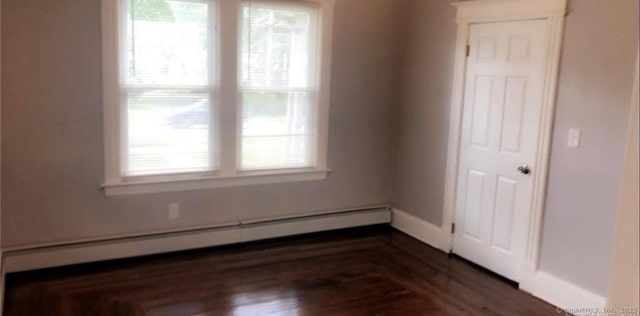 476 Park Ave, Bloomfield, CT 06002 - spare room featuring a baseboard radiator and wood finished floors