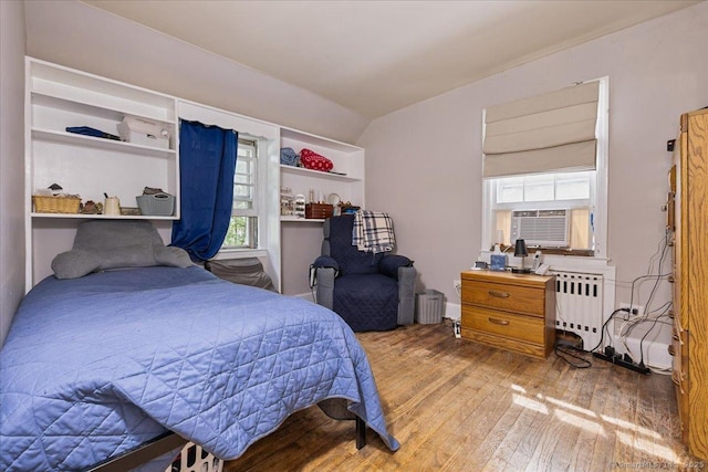 12 Deacon Hill Rd, Stamford, CT 06905 - bedroom featuring radiator, wood-type flooring, and cooling unit