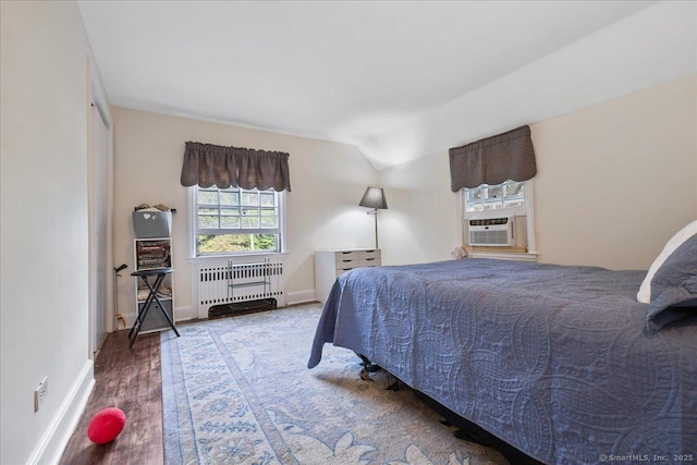 12 Deacon Hill Rd, Stamford, CT 06905 - bedroom featuring radiator heating unit, cooling unit, wood finished floors, and lofted ceiling