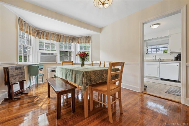 12 Deacon Hill Rd, Stamford, CT 06905 - dining space featuring light wood-style floors, cooling unit, and radiator