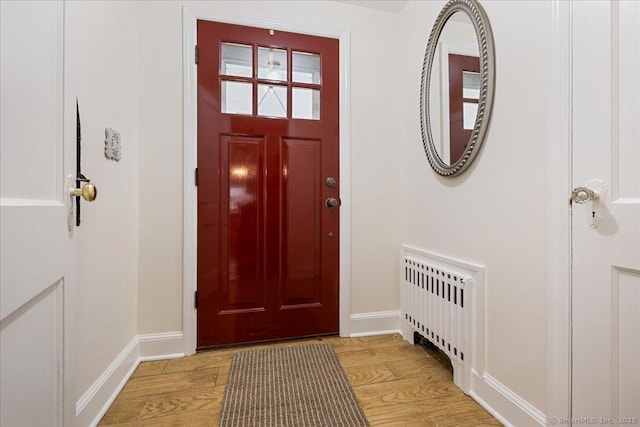 12 Deacon Hill Rd, Stamford, CT 06905 - entrance foyer featuring radiator heating unit and light wood-type flooring
