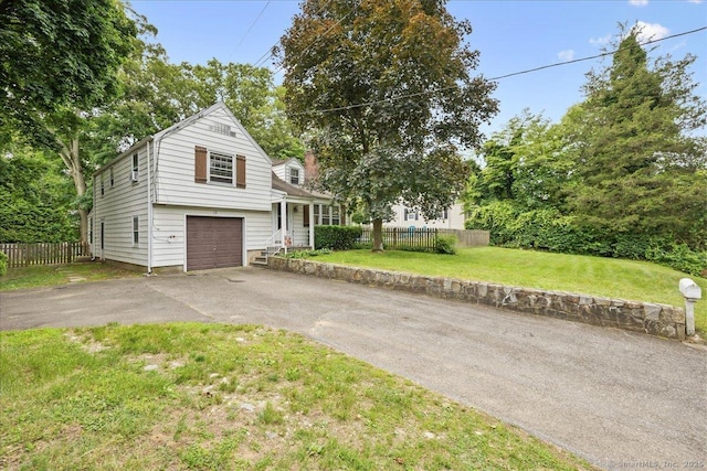 12 Deacon Hill Rd, Stamford, CT 06905 - view of front facade with driveway and a garage