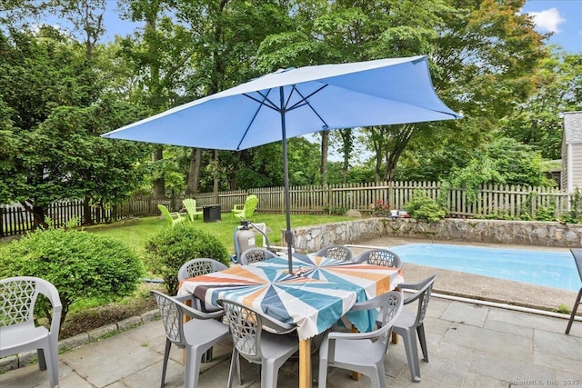 12 Deacon Hill Rd, Stamford, CT 06905 - fenced backyard featuring outdoor dining area, a patio area, and view of wooded area