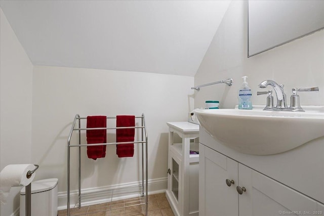 12 Deacon Hill Rd, Stamford, CT 06905 - bathroom with vaulted ceiling, vanity, and tile patterned flooring