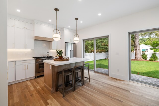 1846 Mill Plain Rd, Fairfield, CT 06824 - kitchen with stainless steel appliances, light wood-style floors, healthy amount of natural light, light countertops, and recessed lighting