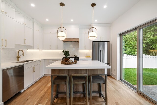 1846 Mill Plain Rd, Fairfield, CT 06824 - kitchen featuring stainless steel appliances, a kitchen island, white cabinetry, and recessed lighting