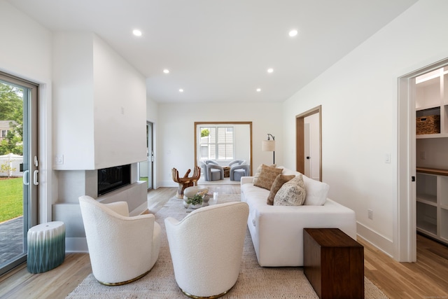 1846 Mill Plain Rd, Fairfield, CT 06824 - living area with light wood finished floors, a high end fireplace, and recessed lighting