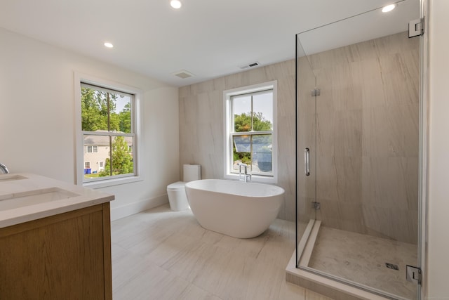 1846 Mill Plain Rd, Fairfield, CT 06824 - full bath with a stall shower, a soaking tub, double vanity, and recessed lighting