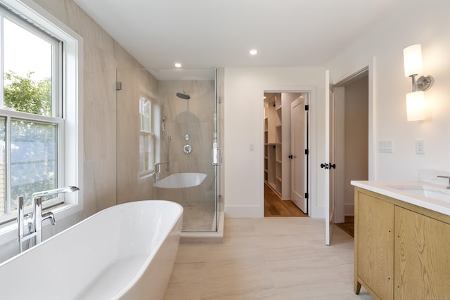1846 Mill Plain Rd, Fairfield, CT 06824 - bathroom with a shower stall, a soaking tub, healthy amount of natural light, vanity, and recessed lighting