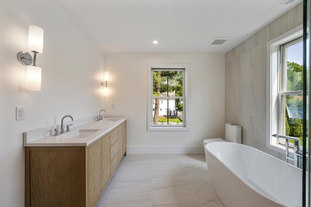 1846 Mill Plain Rd, Fairfield, CT 06824 - bathroom featuring a freestanding tub and double vanity