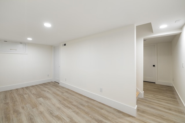 1846 Mill Plain Rd, Fairfield, CT 06824 - finished below grade area with recessed lighting and light wood-style flooring