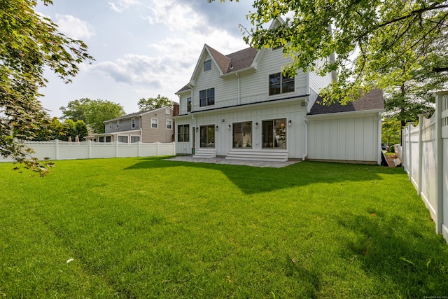 1846 Mill Plain Rd, Fairfield, CT 06824 - back of house featuring board and batten siding, a fenced backyard, roof with shingles, and entry steps