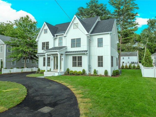 1846 Mill Plain Rd, Fairfield, CT 06824 - view of front of property with board and batten siding, a standing seam roof, a shingled roof, a metal roof, and asphalt driveway