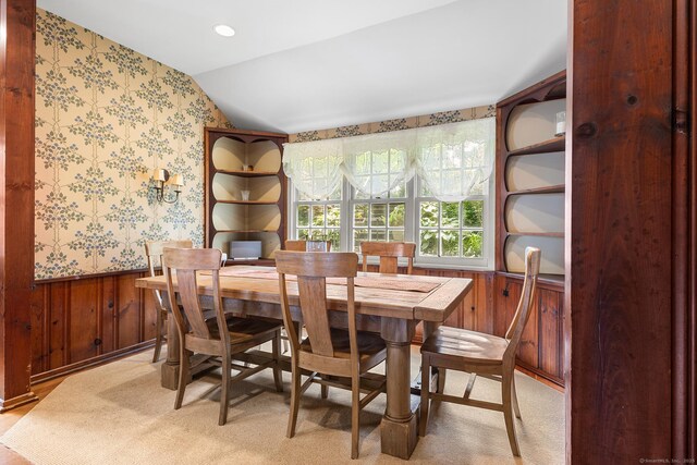 45 Lake Dr S, New Fairfield, CT 06812 - dining area featuring a wainscoted wall, vaulted ceiling, wallpapered walls, and wood walls