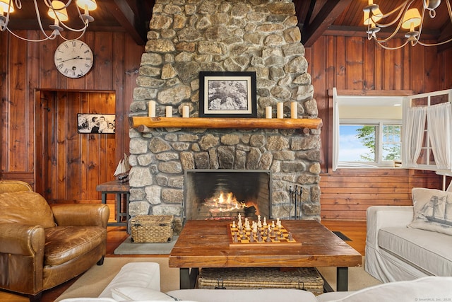 45 Lake Dr S, New Fairfield, CT 06812 - living room with a chandelier, wood walls, a fireplace, a wood ceiling with exposed beams, and wood finished floors