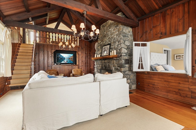 45 Lake Dr S, New Fairfield, CT 06812 - living area featuring a wooden ceiling with exposed beams, stairway, wood finished floors, a chandelier, and a stone fireplace