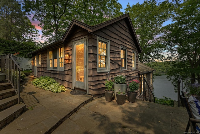 45 Lake Dr S, New Fairfield, CT 06812 - property exterior at dusk with a patio and stairway