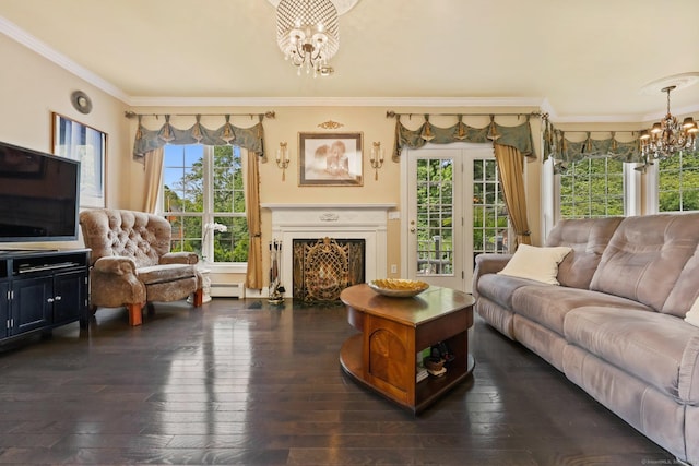 40 Pumpkin Ground Rd, Stratford, CT 06614 - living area featuring a chandelier, dark wood-style flooring, a baseboard heating unit, crown molding, and a warm lit fireplace