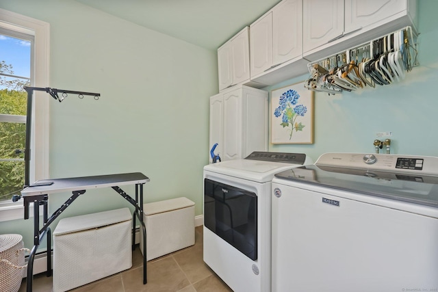 40 Pumpkin Ground Rd, Stratford, CT 06614 - washroom with cabinet space, washer and clothes dryer, light tile patterned floors, and healthy amount of natural light