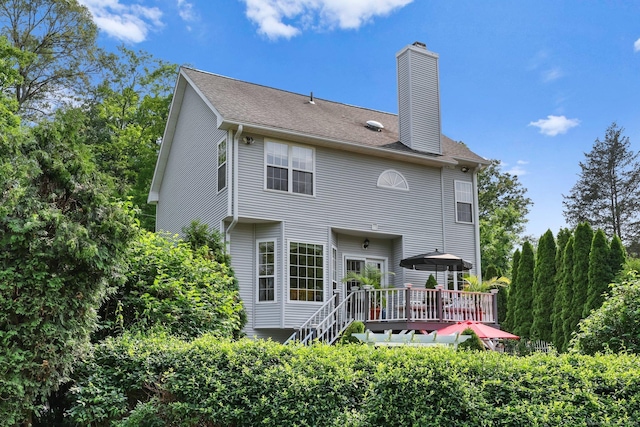 40 Pumpkin Ground Rd, Stratford, CT 06614 - rear view of house with a wooden deck and a chimney