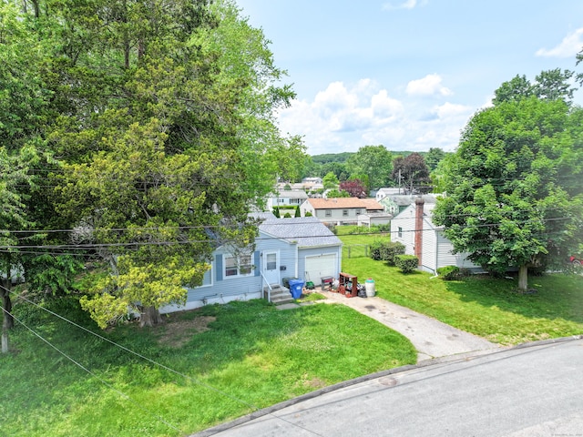 4 Traders Ct, Norwich, CT 06360 - view of front of home with entry steps, driveway, a front yard, and a garage