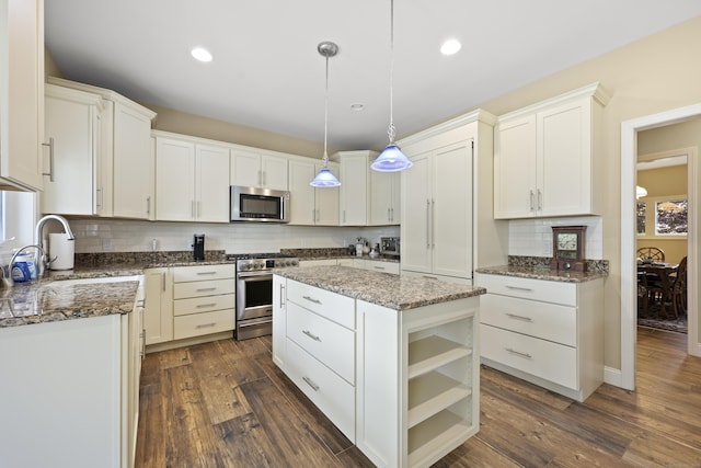 8 Amolia Farms Rd, Windsor, CT 06095 - kitchen featuring appliances with stainless steel finishes, tasteful backsplash, dark stone counters, white cabinetry, and recessed lighting