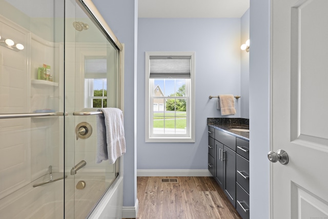 8 Amolia Farms Rd, Windsor, CT 06095 - bathroom with wood finished floors, vanity, and combined bath / shower with glass door