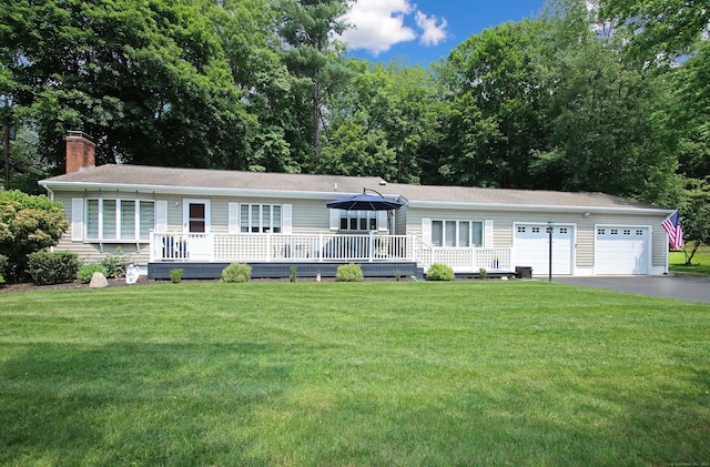 4 White Birch Dr, Guilford, CT 06437 - view of front facade with driveway, a front yard, a chimney, and an attached garage