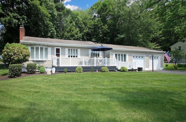 4 White Birch Dr, Guilford, CT 06437 - ranch-style house with a front lawn, a chimney, asphalt driveway, and a deck