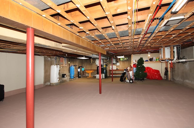 4 White Birch Dr, Guilford, CT 06437 - unfinished basement with a water pressure tank and water heater
