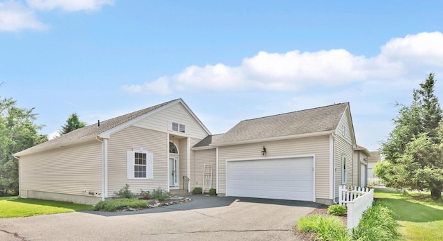 14 Ross Way Unit 14, Windsor Locks, CT 06096 - traditional-style house with an attached garage, asphalt driveway, a front yard, and a shingled roof
