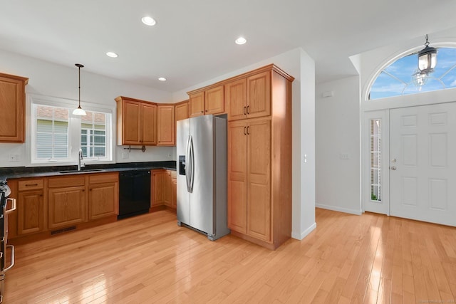 14 Ross Way Unit 14, Windsor Locks, CT 06096 - kitchen with appliances with stainless steel finishes, dark countertops, light wood-style flooring, decorative light fixtures, and brown cabinets