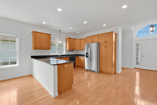 14 Ross Way Unit 14, Windsor Locks, CT 06096 - kitchen with black appliances, a peninsula, dark countertops, light wood-style flooring, and recessed lighting