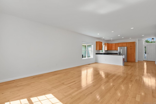 14 Ross Way Unit 14, Windsor Locks, CT 06096 - unfurnished living room with recessed lighting, light wood-style floors, and healthy amount of natural light
