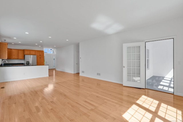 14 Ross Way Unit 14, Windsor Locks, CT 06096 - unfurnished living room featuring recessed lighting and light wood-style flooring