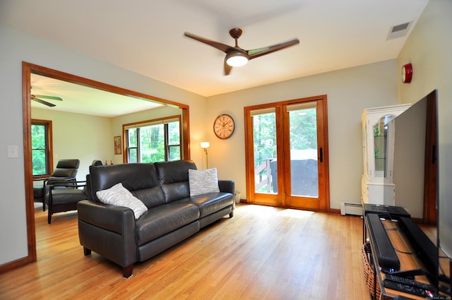127 Weldon Ct, Goshen, CT 06756 - living room with a ceiling fan, a baseboard heating unit, and light wood-style floors