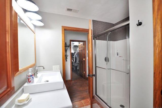 127 Weldon Ct, Goshen, CT 06756 - bathroom featuring a shower stall, vanity, and wood finished floors