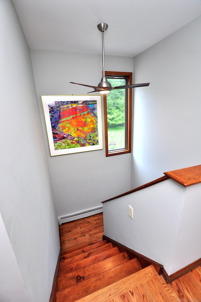 127 Weldon Ct, Goshen, CT 06756 - stairway featuring baseboard heating, wood finished floors, and ceiling fan