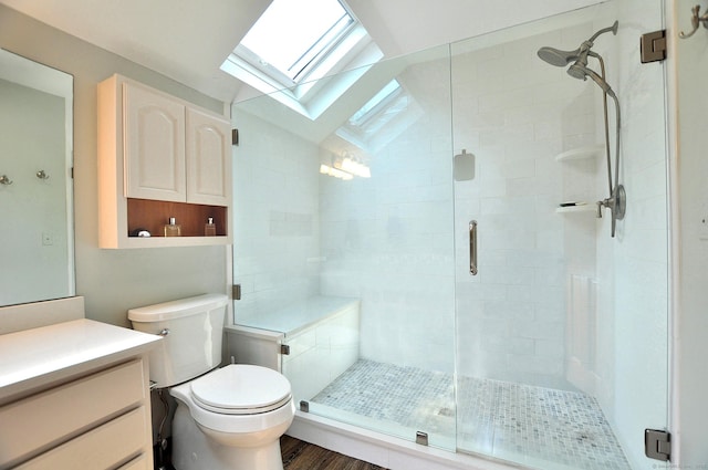 127 Weldon Ct, Goshen, CT 06756 - full bathroom featuring a skylight, vaulted ceiling, a stall shower, vanity, and wood finished floors