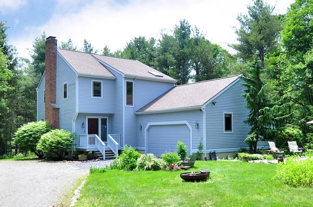 127 Weldon Ct, Goshen, CT 06756 - view of front facade with a chimney, a garage, a front lawn, and roof with shingles