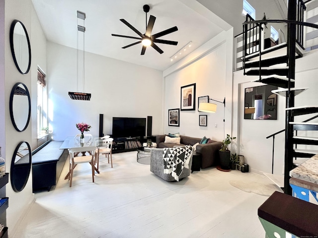 125 Washington St Apt 306, Norwalk, CT 06854 - living room featuring a towering ceiling, ceiling fan, and stairs
