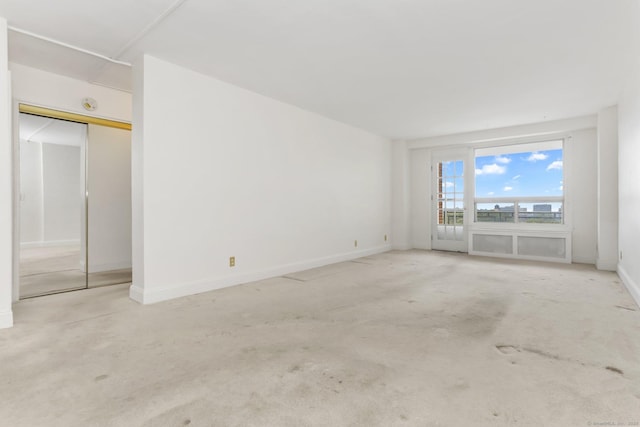 71 Strawberry Hill Ave Apt 1002, Stamford, CT 06902 - unfurnished bedroom featuring baseboards and carpet flooring