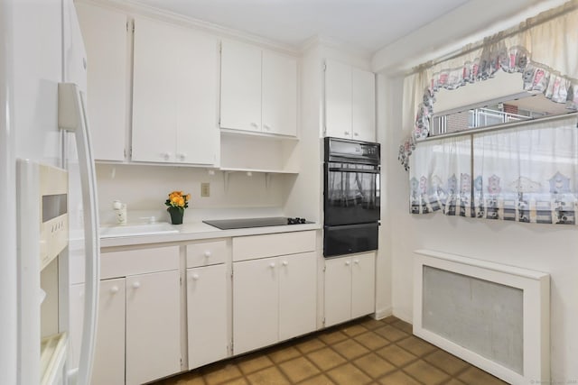 71 Strawberry Hill Ave Apt 1002, Stamford, CT 06902 - kitchen featuring black appliances, a warming drawer, white cabinets, light countertops, and open shelves
