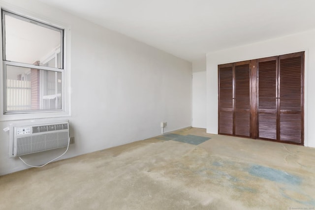 71 Strawberry Hill Ave Apt 1002, Stamford, CT 06902 - unfurnished bedroom with carpet floors, a wall mounted AC, and a closet