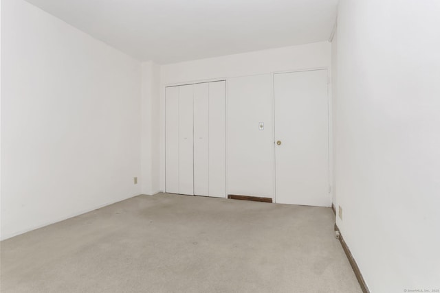71 Strawberry Hill Ave Apt 1002, Stamford, CT 06902 - unfurnished bedroom with light colored carpet and a closet