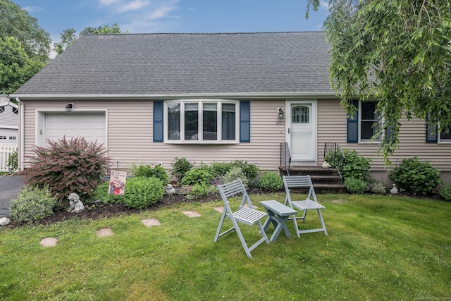 309 Russo Dr, Hamden, CT 06518 - view of front of property with a garage, a front lawn, and a shingled roof