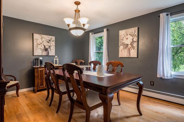 309 Russo Dr, Hamden, CT 06518 - dining room featuring light wood-type flooring, baseboard heating, and a chandelier