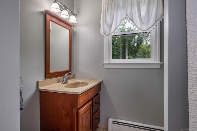 309 Russo Dr, Hamden, CT 06518 - bathroom with baseboard heating, vanity, and tile patterned flooring